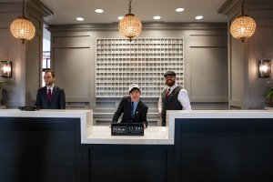 TJ and Jeffrey at the front desk